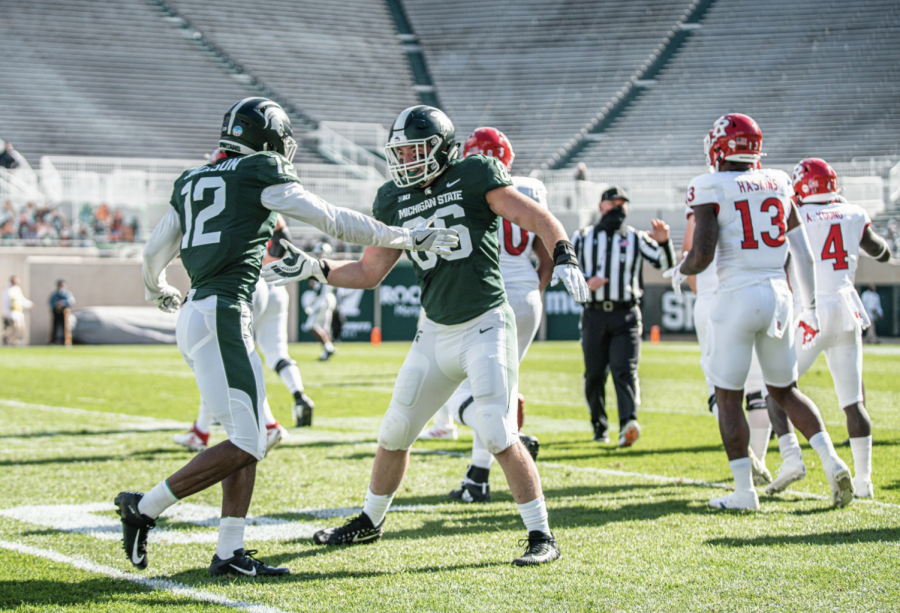 Chris+Jackson+and+Drew+Beesley+high-five+each+other%2F+Photo+Credit%3A+MSU+Athletic+Communications