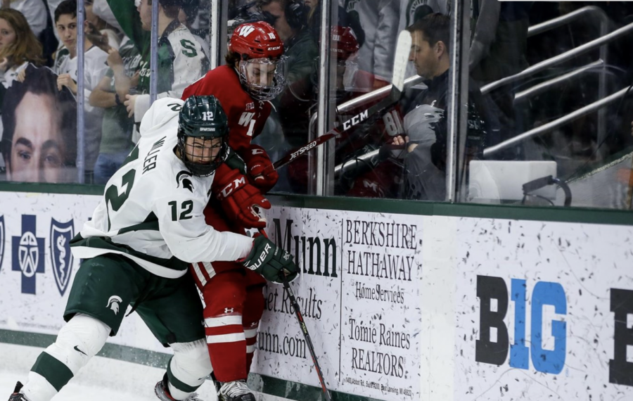 MSU defenseman Tommy Miller battles for the puck against Wisconsin/ Photo Credit: MSU Athletic Communications
