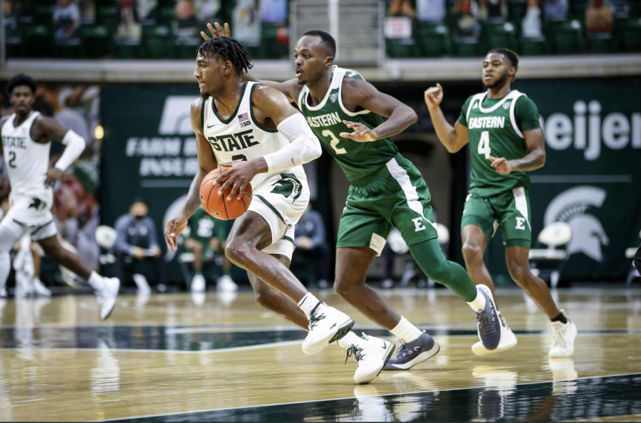 Aaron Henry brings the ball up the floor against Eastern Michigan/ Photo Credit: MSU Athletic Communications
