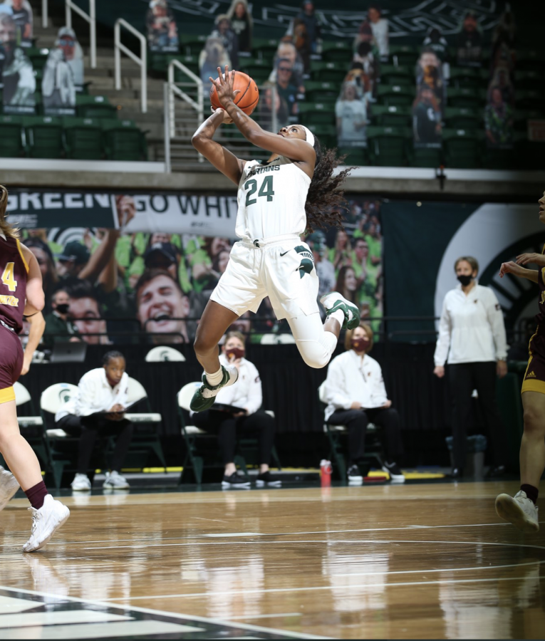 Nia Clouden attempts a layup under the net against Central Michigan/ Photo Credit: MSU Athletic Communications