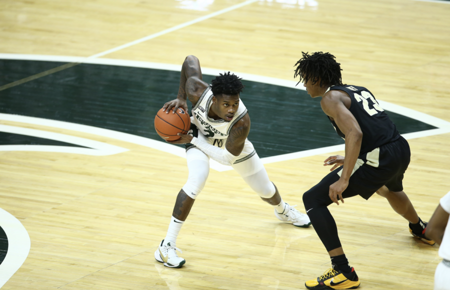 Rocket+Watts+tries+to+dribble+past+Purdue+G+Jaden+Ivey%2F+Photo+Credit%3A+MSU+Athletic+Communications%0A%0A