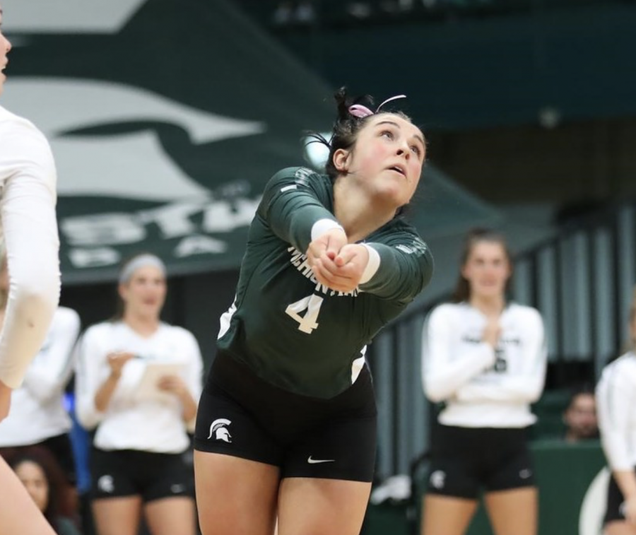 MSU defensive specialist Jayme Cox sets a pass during a game/ Photo Credit: MSU Athletic Communications