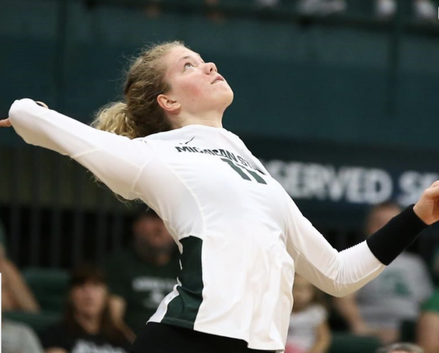 MSU outside hitter Alyssa Chronowski rises to serve during a game/ Photo Credit: MSU Athletic Communications