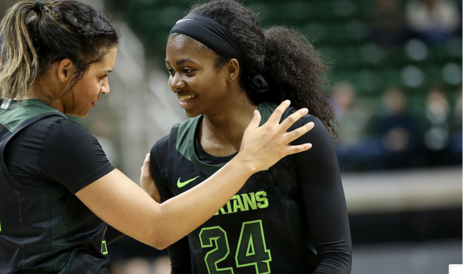 Mo Joiner smiles alongside Nia Clouden (24)/ Photo Credit: MSU Athletic Communications


