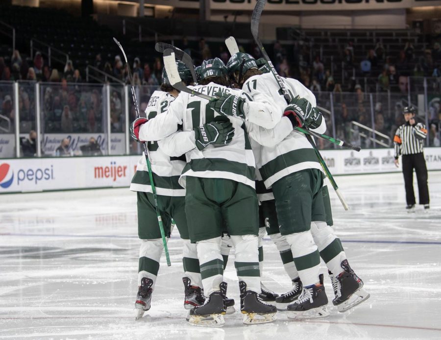 The+MSU+hockey+team+huddles+together+before+a+game%2F+Photo+Credit%3A+MSU+Athletic+Communications%0A%0A