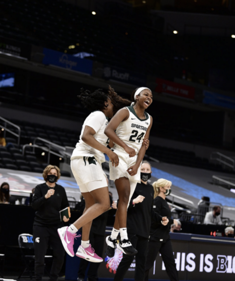 Nia+Clouden+and+Janai+Crooms+celebrate+after+MSU+knocks+off+Penn+State+75-66+in+the+first+round+of+the+2021+Big+Ten+tournament%2F+Photo+Credit%3A+MSU+Athletic+Communications%0A%0A%0A
