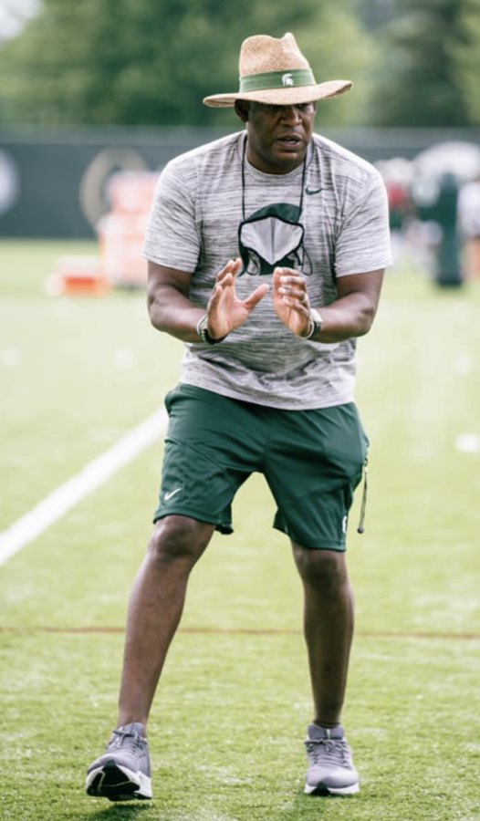 MSU head coach Mel Tucker offers instructions to a group of players during 2021 fall camp/ Photo Credit: MSU Athletic Communications 