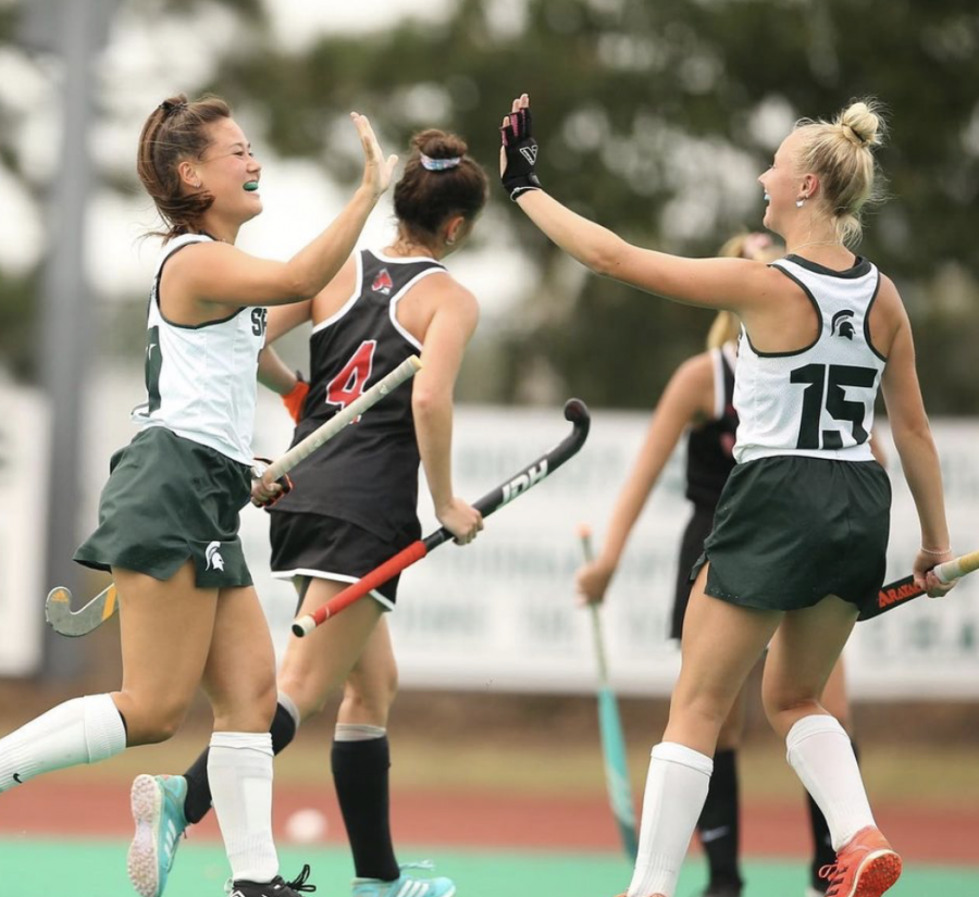 MSU midfielder Ellie Rutherford (15) high-fives Merel Hanssen in the Spartans 7-1 victory over Ball State on Sept. 12/ Photo Credit: MSU Athletic Communications 