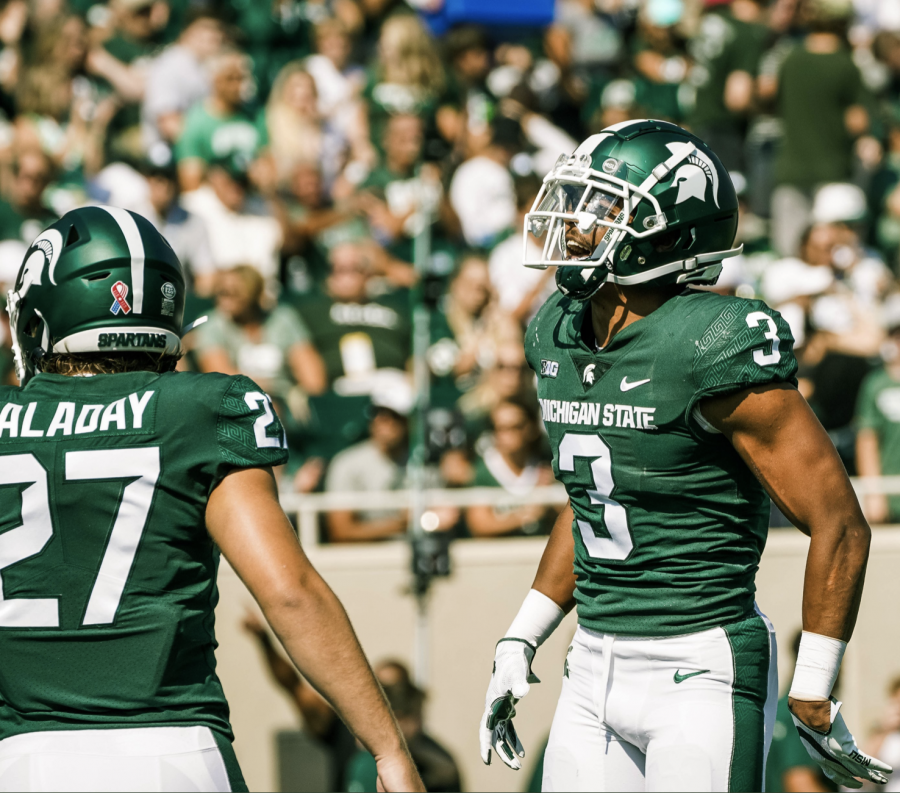 MSU linebacker Cal Haladay (27) and safety Xavier Henderson (3) smile in the Spartans 42-14 home win over Youngstown State on Sept. 18/ Photo Credit: MSU Athletic Communications 
