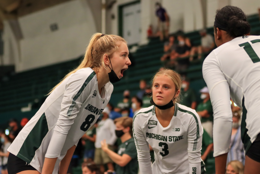 MSU middle blocker Aubrey O Gorman (8), and defensive specialist Grace Danzinger (3) talk together during the Spartans 3-0 win over Oakland on Sept. 17/ Photo Credit: Sarah Smith/WDBM