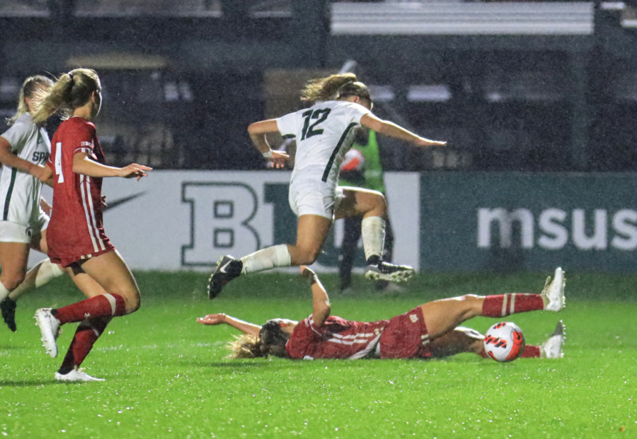 MSU forward Jordyn Wickes leaps over a Wisconsin defender in the Spartans 1-0 loss on Sept. 23, 2021/ Photo Credit: Sarah Smith/WDBM