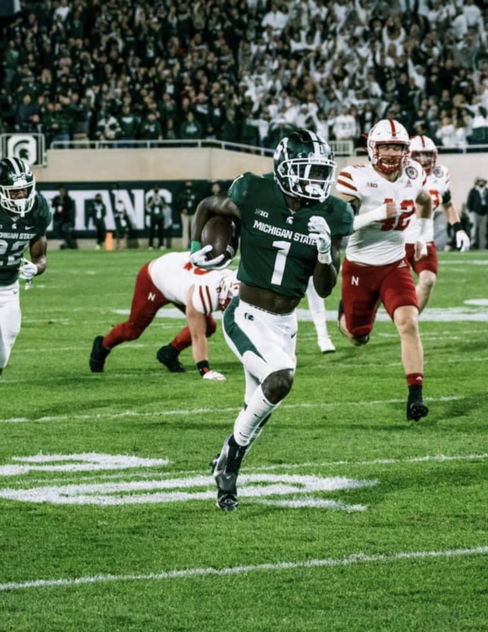 MSU wide receiver Jayden Reed returns a punt for a 62-yard touchdown against Nebraska on Sept. 25, 2021/ Photo Credit: MSU Athletic Communications 