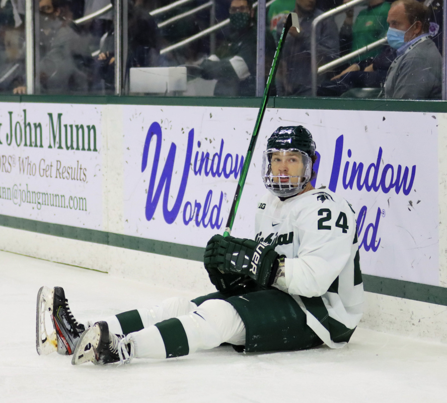 MSU forward Erik Middendorf lays on the ice after taking a big hit in the Spartans 3-1 win over Miami (OH) on Oct. 15, 2021/ Photo Credit: Sarah Smith/WDBM