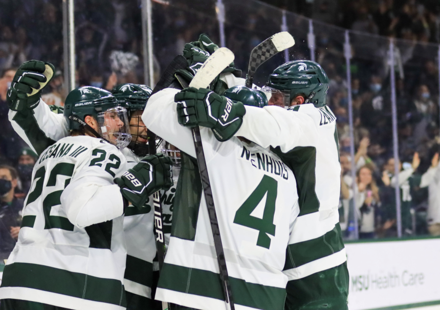 MSU defenseman Nash Nienhius (4) and teammates celebrate after scoring a goal in the Spartans 2-1 win over Miami (OH) on Oct. 16, 2021/ Photo Credit: Sarah Smith/WDBM