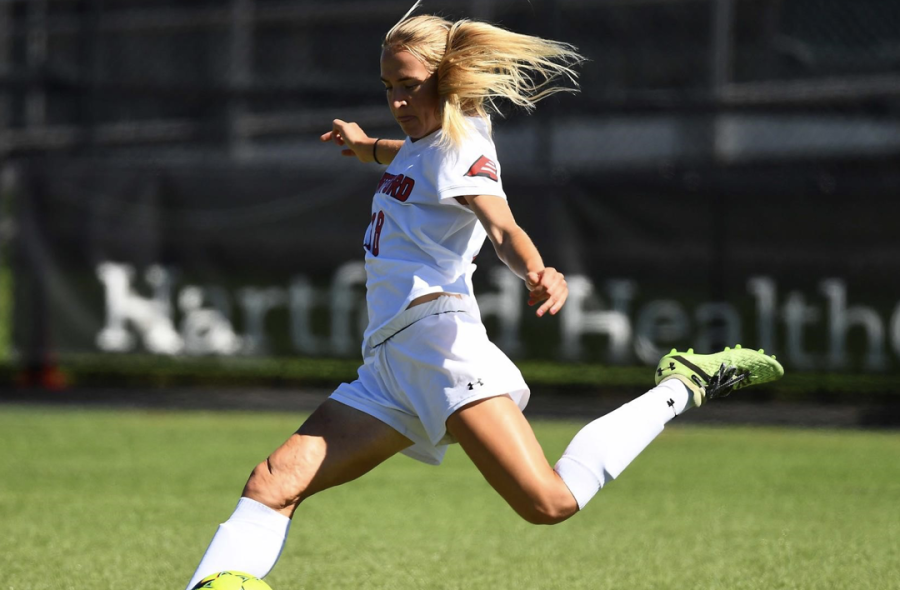 MSU transfer midfielder Kelly Severini winds up for a powerful kick during her time at Hartford/ Photo Credit: Hartford Athletics