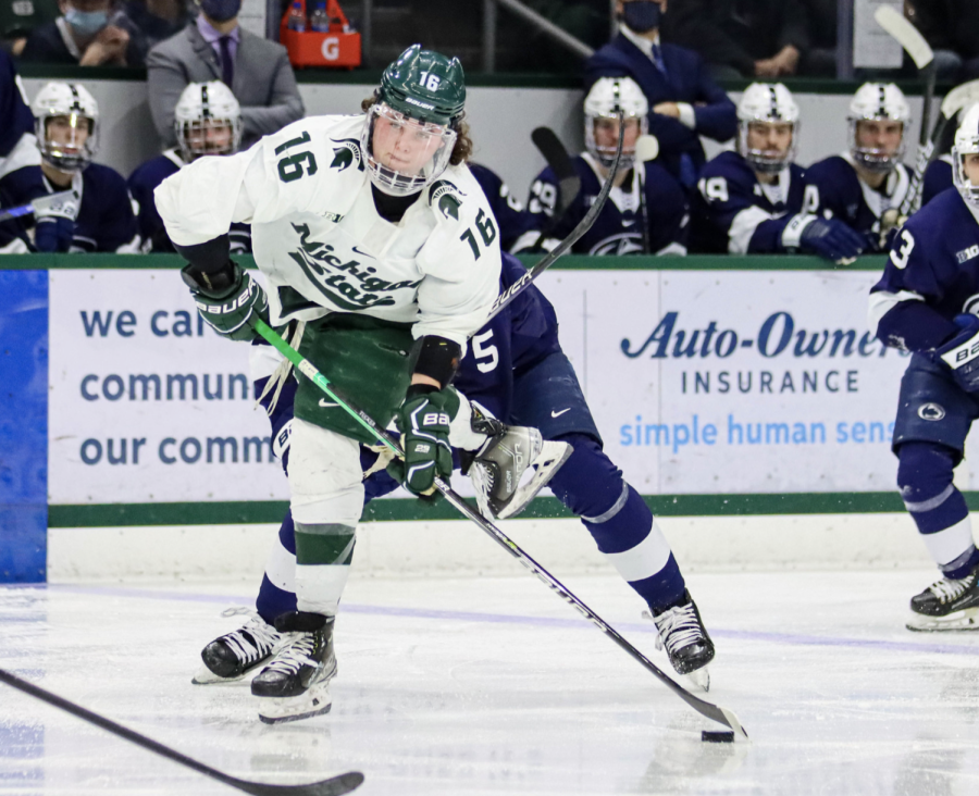 MSU forward Jesse Tucker shoots the puck during the Spartans 5-3 loss to Penn State on Feb. 25, 2022/ Photo Credit: Sarah Smith/WDBM