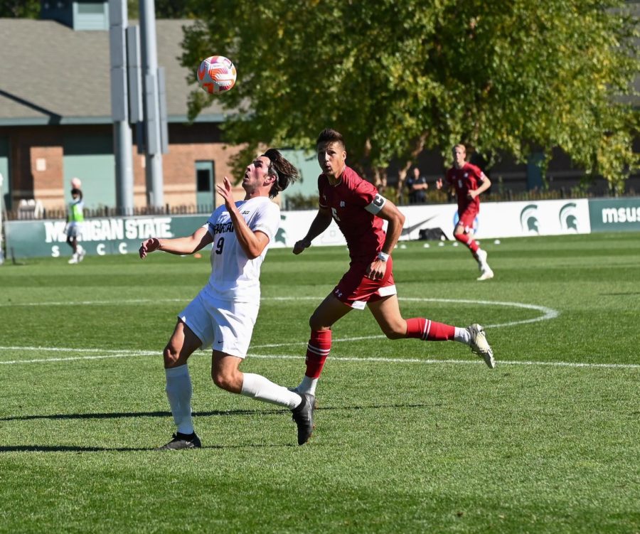 Greyson Mercer attempts to keep the ball away from a Wisconsin defender in the Spartans 1-0 victory over the Badgers on October 2, 2022. Photo Credit: Jack Moreland/WDBM