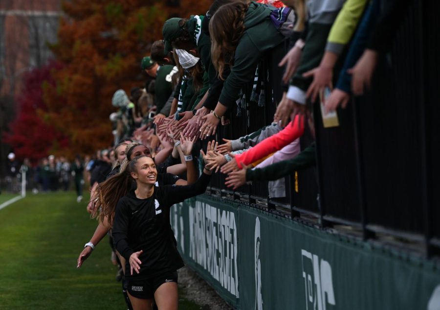 Lauren DeBeau celebrates with fans after the game against Minnesota Oct. 30, 2022/ Photo credit: Jack Moreland