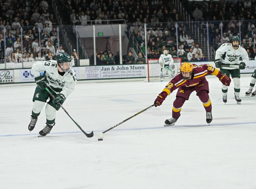 Tiernan Shoudy moves the puck up the ice during Michigan States loss to Minnesota on December 2, 2022. Photo Credit: Jack Moreland/WDBM