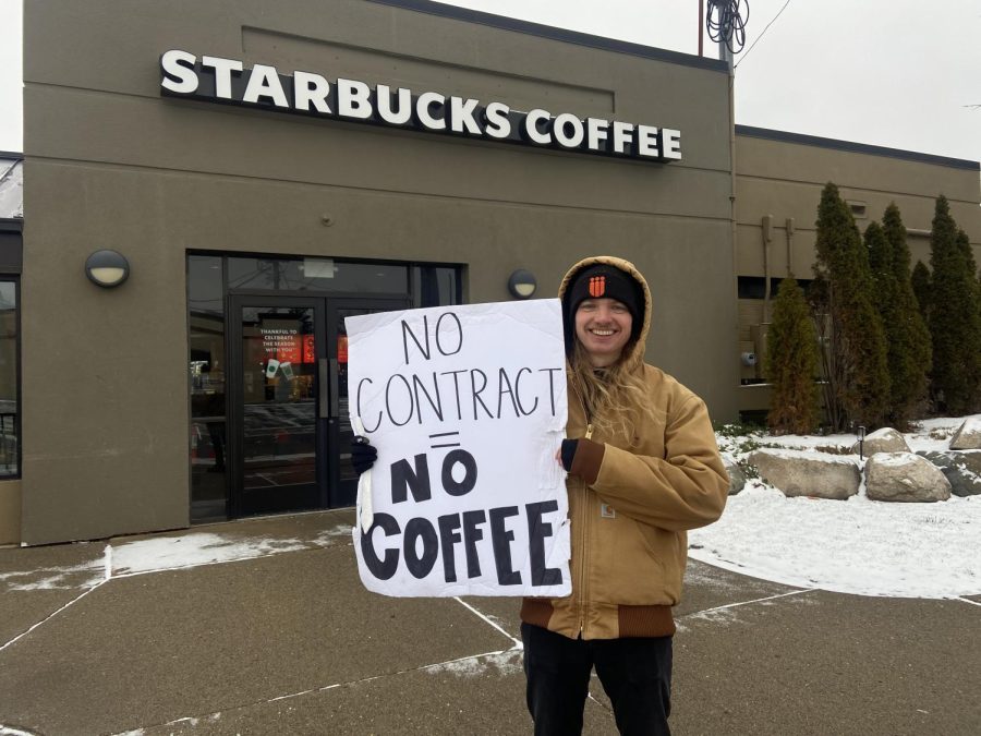 Matthew Kain holding his sign outside the strike location