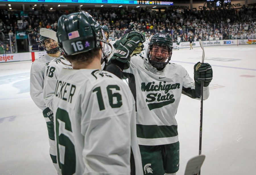 Jesse Tucker and Tanner Kelly celebrate after Michigan States 2-1 victory over Michigan on December 9, 2022. Photo Credit: Sarah Smith/WDBM