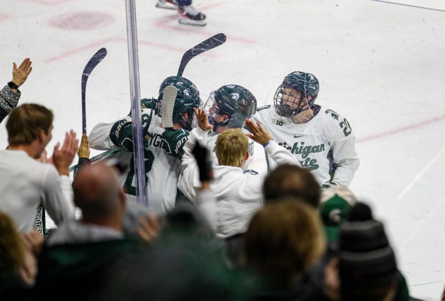 Michigan State Hockey celebrates after their first goal during their game against Michigan on December 9, 2022. Photo Credit: Sarah Smith/WDBM