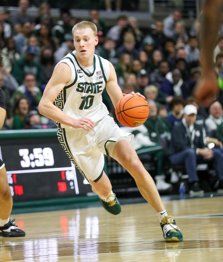 Joey Hauser dribbles toward the lane during Michigan States victory over Brown on December 10, 2022. Photo Credit: Sarah Smith/WDBM