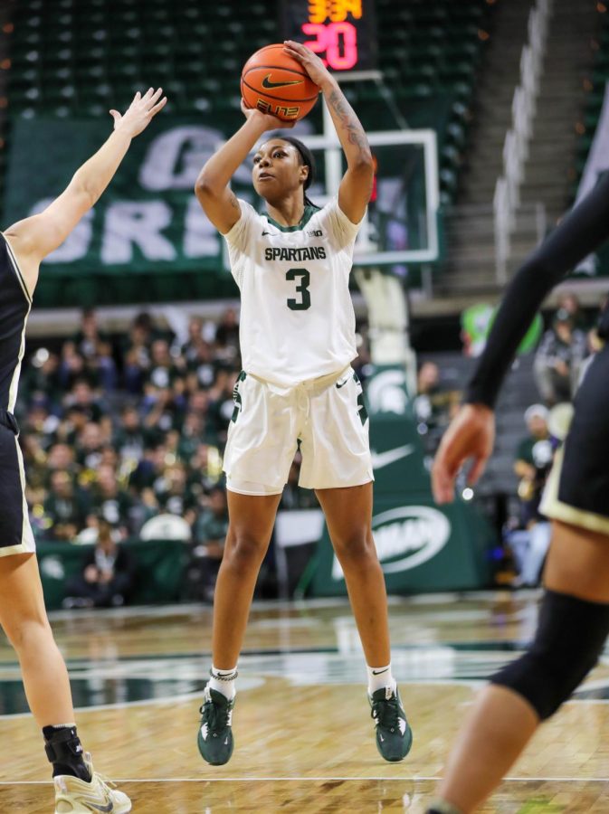 Gabby Elliott shoots a three-pointer during Michigan States overtime loss to Purdue on December 5, 2022. Photo Credit: Sarah Smith/WDBM