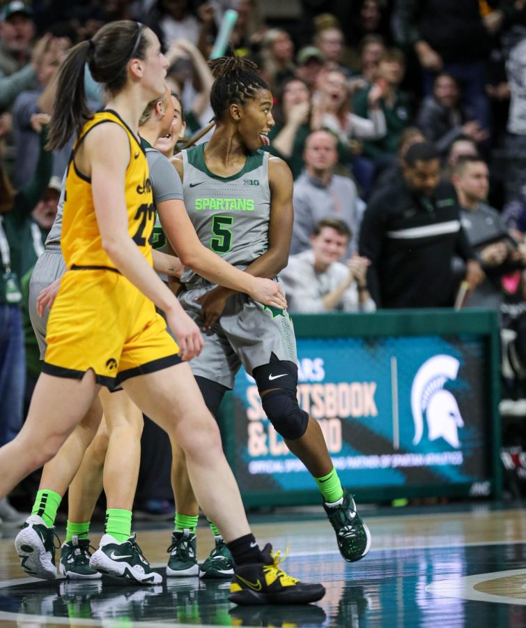 Kamaria McDaniel celebrates after her buzzer beating half-court shot at the half during Michigan States 84-81 overtime loss to No. 10 Iowa on January 18, 2023. Photo Credit: Sarah Smith/WDBM