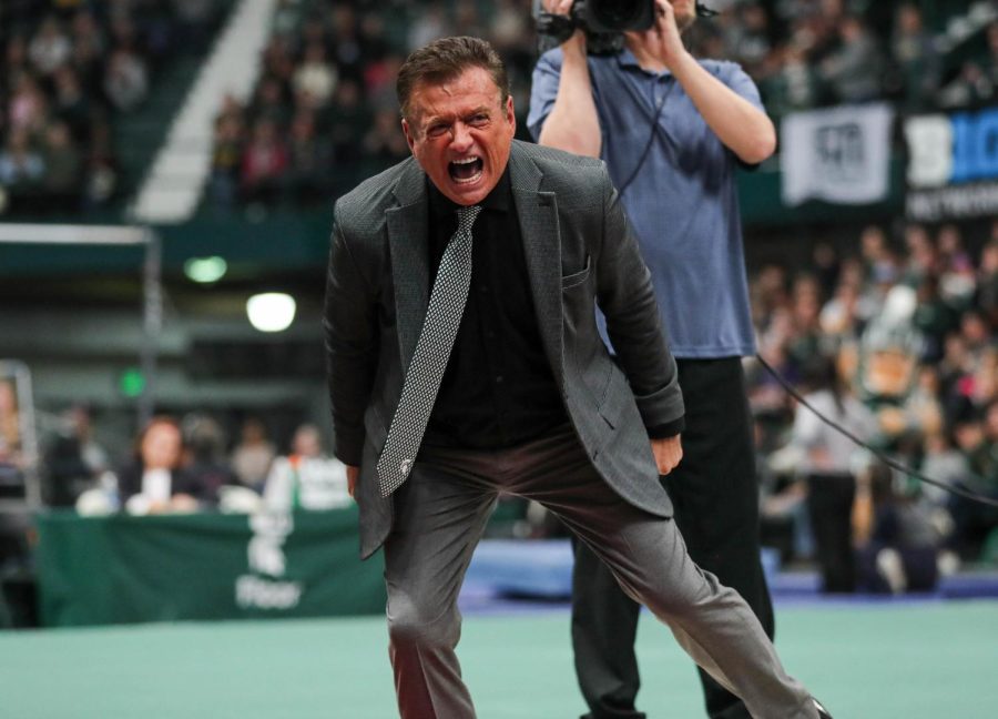 Head Coach Mike Rowe celebrates after a vault routine during Michigan States 197.200-196.975 victory over No. 3 Michigan on January 22, 2023. Photo Credit: Sarah Smith/WDBM