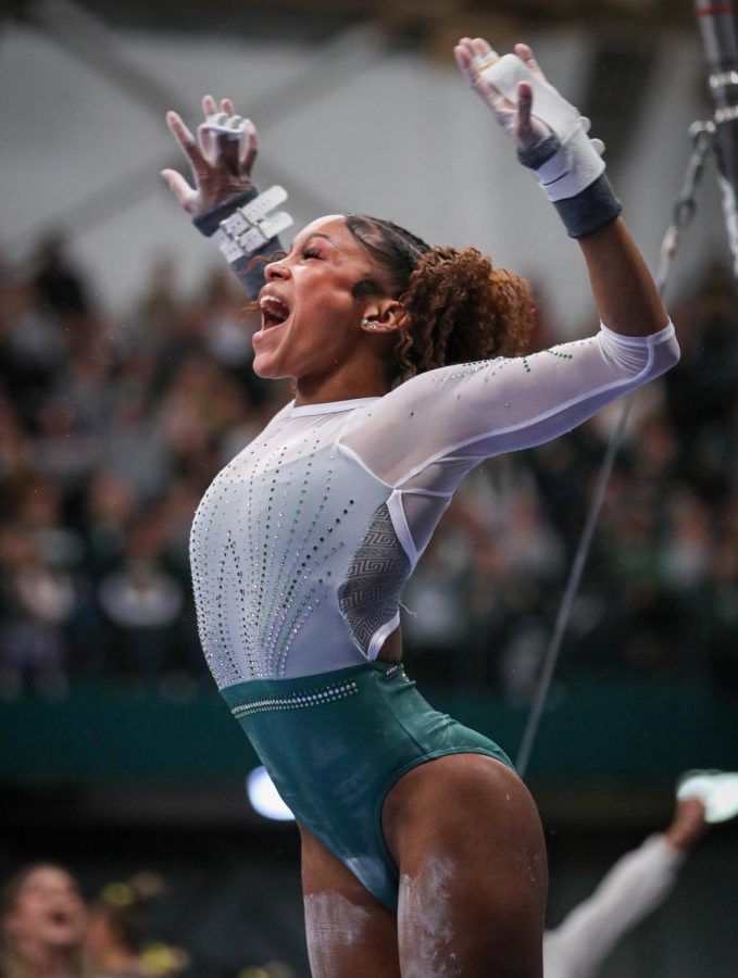 Nikki Smith celebrates after her bar routine during Michigan States 197.200-196.975 victory over No. 3 Michigan on January 22, 2023. Photo Credit: Sarah Smith/WDBM