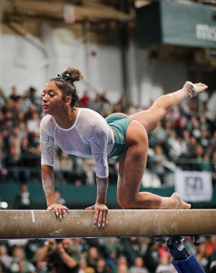 Skyla Schulte performs her beam routine during Michigan States 197.200-196.975 victory over No. 3 Michigan on January 22, 2023. Photo Credit: Sarah Smith/WDBM
