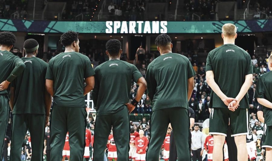 The+Michigan+State+Spartans+line+up+for+the+national+anthem+ahead+of+their+game+against+Nebraska+on+January+3%2C+2022.+Photo+Credit%3A+Jack+Moreland%2FWDBM