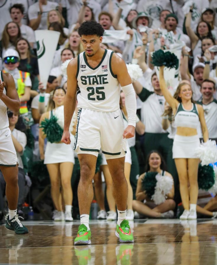 Malik Hall stares at Michigan defenders after a basket during Michigan States 59-53 victory over Michigan on January 7, 2023. Photo Credit: Sarah Smith/WDBM