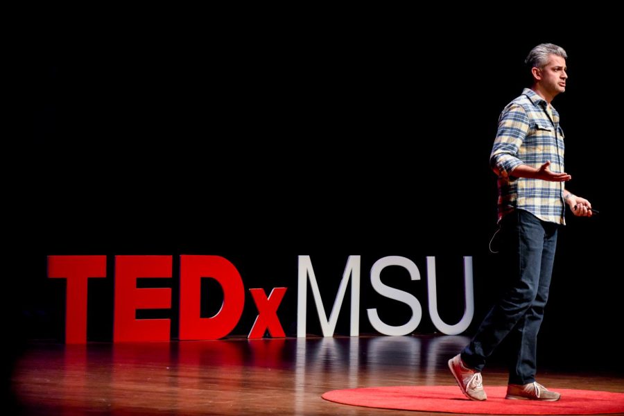 Isaac Record speaks about critical thinking and critical making during the 2023 TEDxMSU conference at the Wharton Center on April 2, 2023. (Photo by Andrew Roth, Impact 89FM)