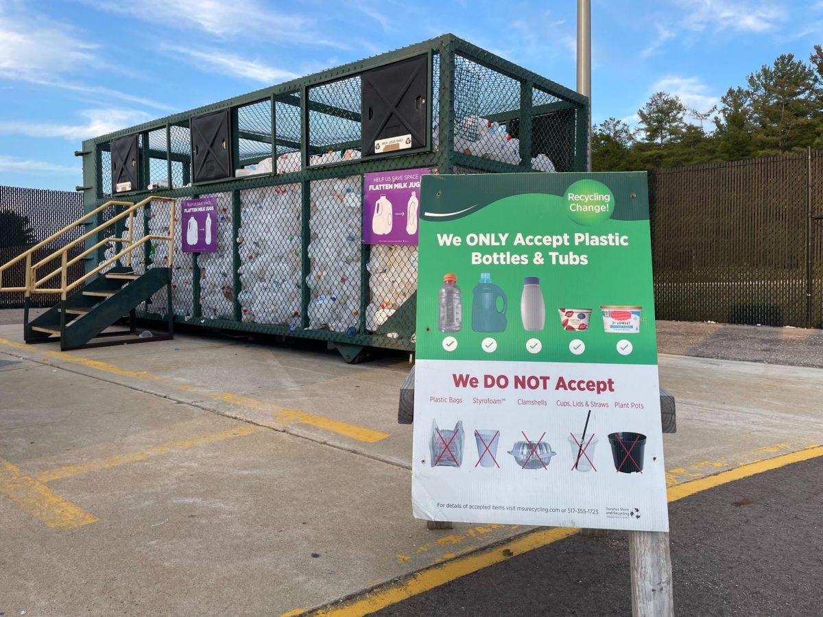A sign outside the MSU recycling center that provides crucial information on the types of plastics it accepts. Each recycling center has different rules as to what types of plastics it can take. Photo Credit: Tessa Kresch/WDBM