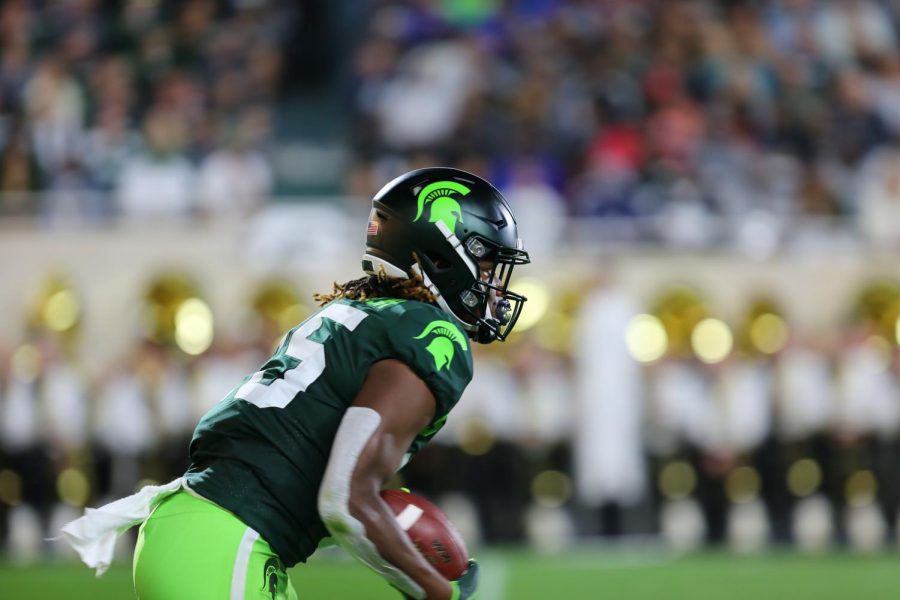 Wide Receiver Darrell Stewart carries the football against Western Michigan.

Credit: Zengyi Sun / Red Cedar Log (IG: amazingszy)