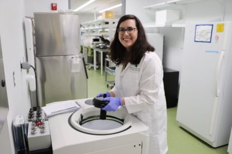 Victoria Toomajian in Lab by an ultracentrifuge