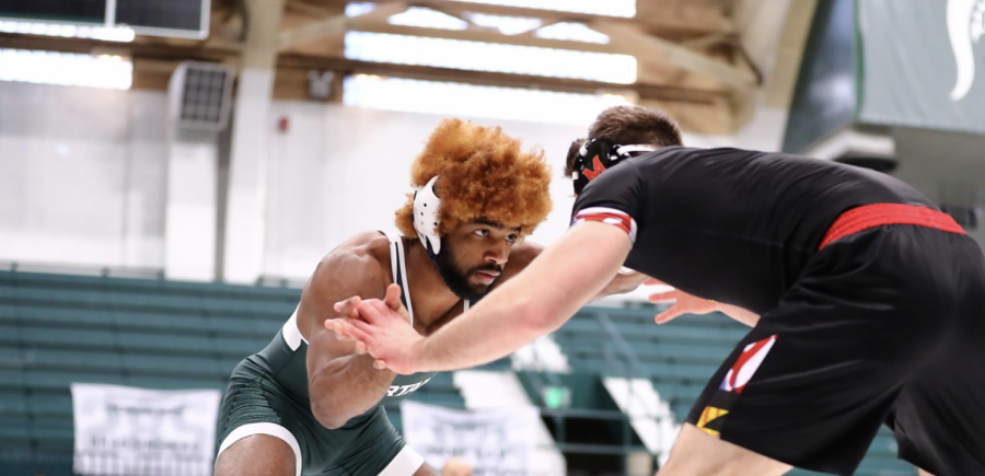 MSU wrestler Cameron Caffey grapples with an opponent/Photo: Michigan State Athletic Communications 