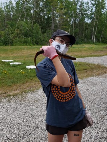 Emily Mensch holding a Sea Lamprey