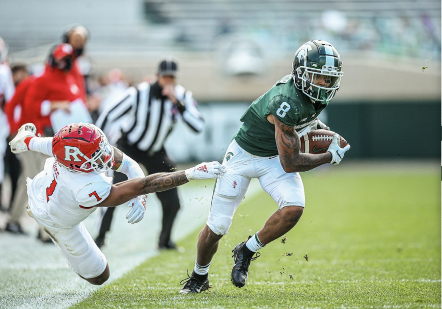 MSU wide receiver Jailen Nailor makes a catch and avoids Rutgers cornerback Brendon White/ Photo Credit: MSU Athletic Communications

