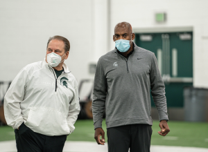 Tom Izzo and Mel Tucker talk during practice/ Photo Credit: MSU Athletic Communications

