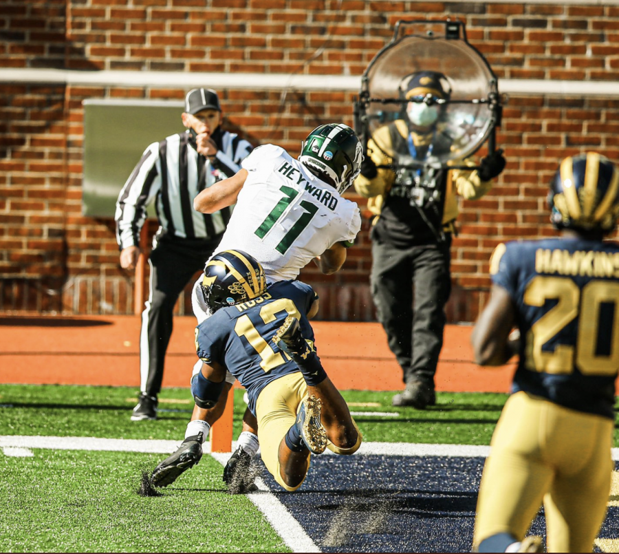 Connor Heyward scores in the flat against Michigan linebacker Josh Ross/ Photo Credit: MSU Athletic Communications 