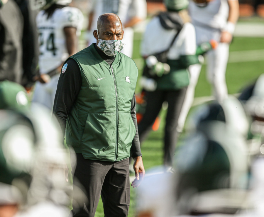 Mel Tucker watches his team warm up before the Michigan game/ Photo Credit: MSU Athletic Communications
