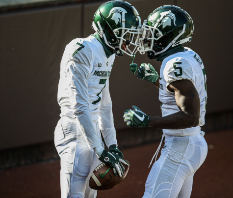 Ricky White and Jayden Reed celebrate Whites first career touchdown/ Photo Credit: MSU Athletic Communications 
