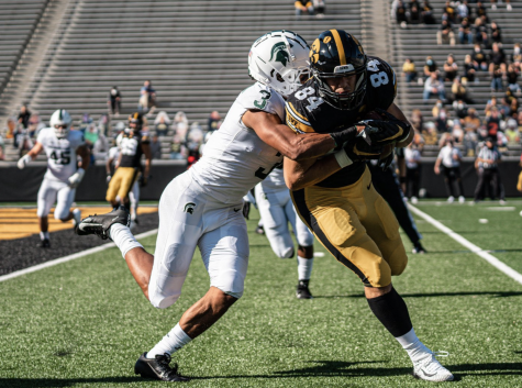 Xavier Henderson wraps up Iowa TE Sam LaPorta/ Photo Credit: MSU Athletic Communications 