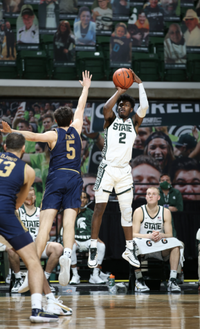Rocket Watts attempts a jump shot over Notre Dame guard Cormac Ryan/Photo credit: MSU Athletic Communications