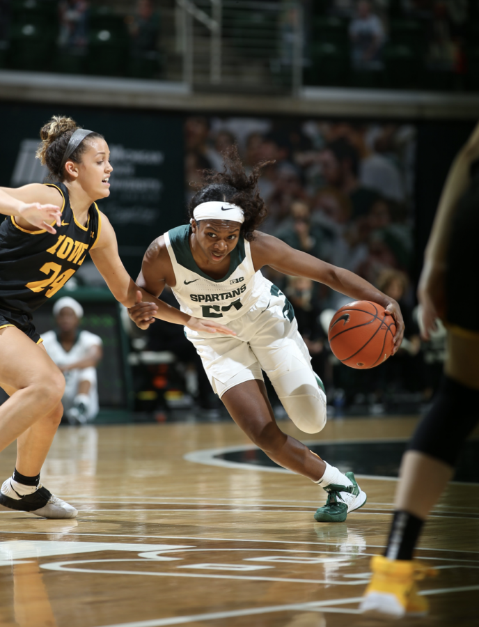 Nia+Clouden+dribbles+past+Iowa+G+Gabbie+Marshall%2F+Photo+Credit%3A+MSU+Athletic+Communications%0A