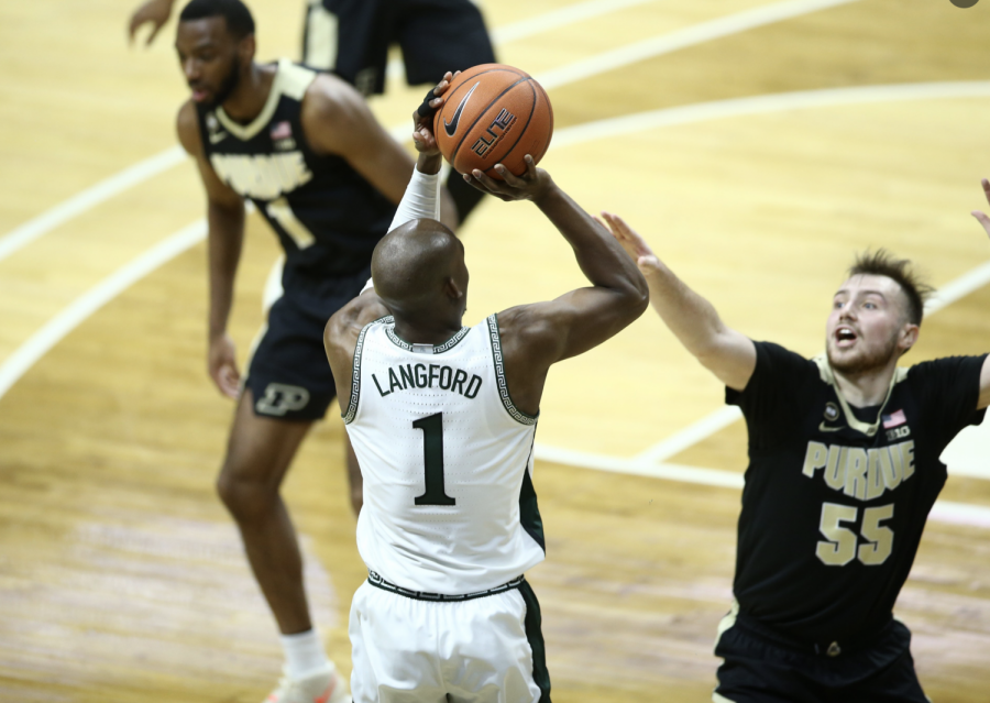 Joshua+Langford+attempts+a+3-pointer+over+Purdue+G+Sasha+Stevanovic%2F+Photo+Credit%3A+MSU+Athletic+Communications%0A