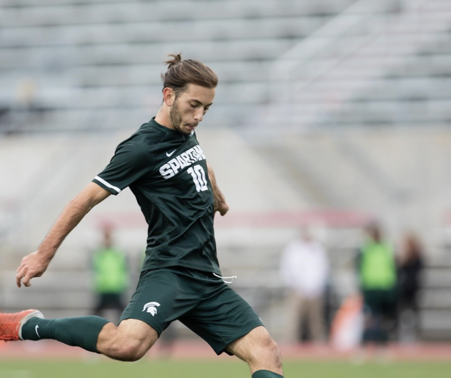 MSU+midfielder+Giuseppe+Baron+attempts+a+kick+during+a+game%2F+Photo+Credit%3A+MSU+Athletic+Communications%0A